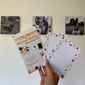 Paw Print Birthday Celebration Kit with Framed Animal Photos in Background